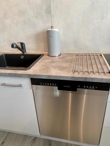 a kitchen with a sink and a counter top at "Mittendrin" in Garmisch in Garmisch-Partenkirchen