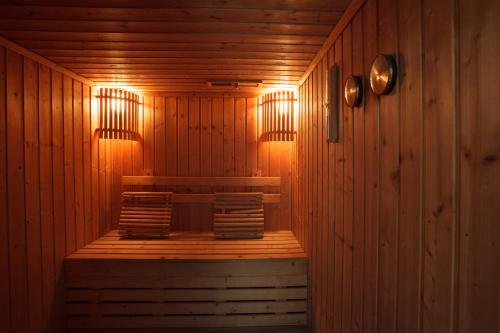 a sauna with wooden walls and lights in a room at 2C-Short-term rental allowed-2BRs Downtown Bangkok in Bangkok