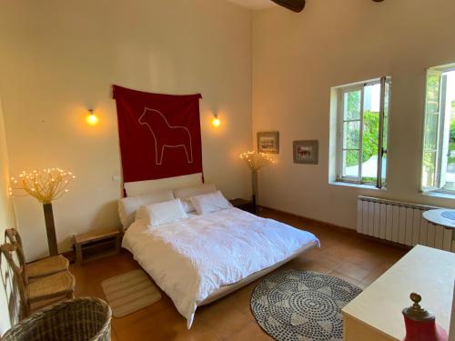 Cama o camas de una habitación en Adorable maison de village, grande terrasse 4 pers