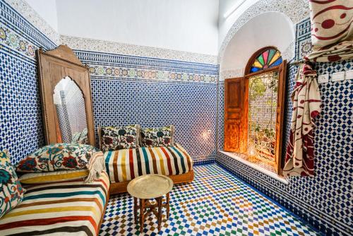 Postel nebo postele na pokoji v ubytování Riad Taj Salma