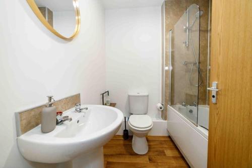 a white bathroom with a sink and a toilet at Townhouse (C) in private grounds 8 mins from city in Dunston