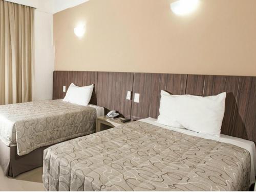 Ліжко або ліжка в номері Hotel Abba Uno