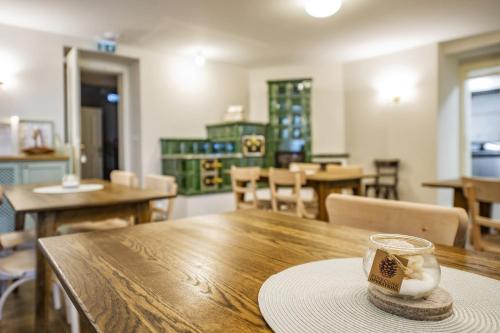 a dining room with a table with a candle on it at Vila Lavina in Smokovce