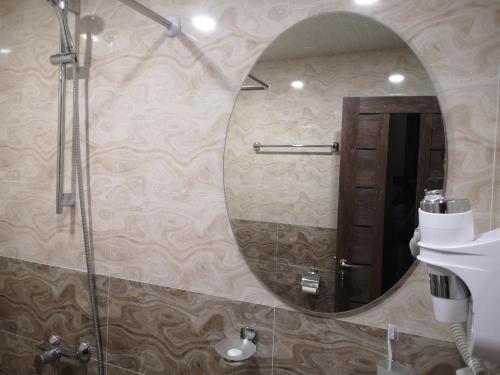 a bathroom mirror with a shower and a sink at 7ROOMS boutique hotel in Yeghegnadzor