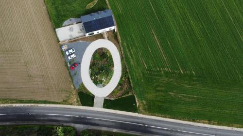 an aerial view of a field with a white circle at B&B Entre Champs in Ohain