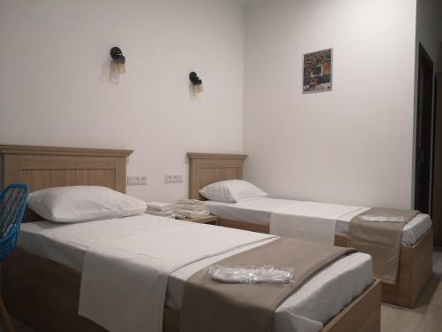 a room with two beds in a room at 7ROOMS boutique hotel in Yeghegnadzor