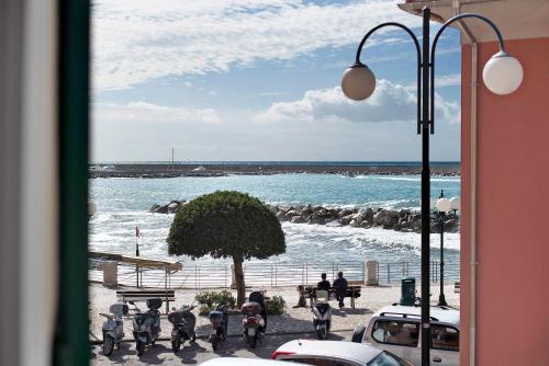 a view of the beach from a building with a street light at A due passi dal mare in Chiavari