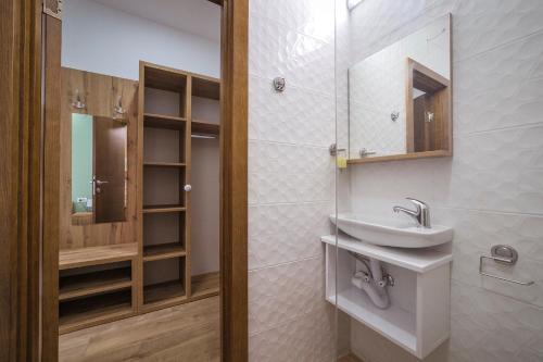 a bathroom with a sink and a mirror at Zoe Pirot in Pirot
