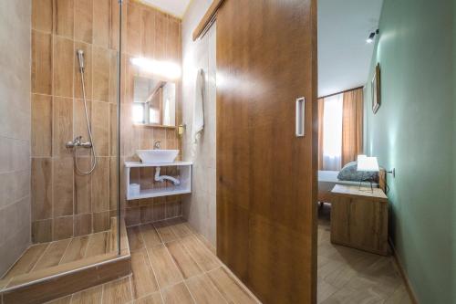 a bathroom with a shower and a sink at Zoe Pirot in Pirot