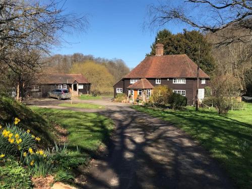 a house and a road in front of a house at Halfmoon Lodge @ Knights Hole wheelchair access in Cranbrook