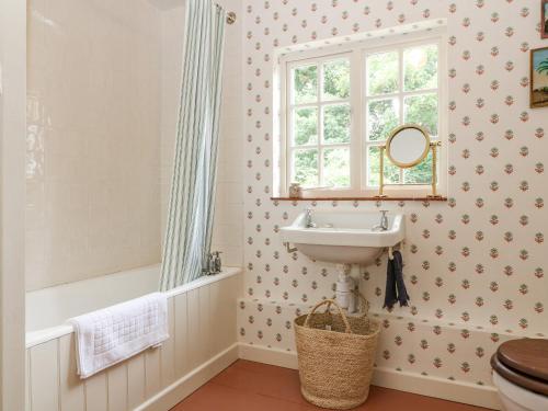 a bathroom with a sink and a window at 31 Manor Road in Charlbury
