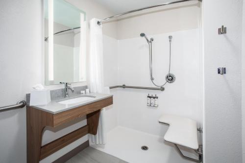 a bathroom with a sink and a shower at Candlewood Suites Grand Junction by IHG in Grand Junction