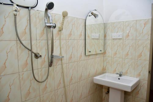 a bathroom with a shower and a sink at Sholay Villa in Galle