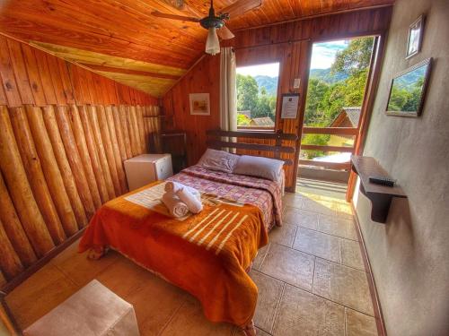 Cama ou camas em um quarto em Pousada Colibri Serrano