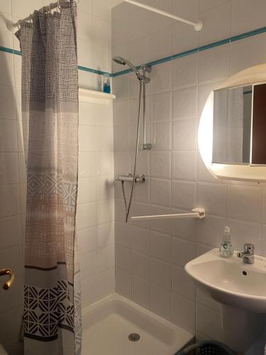 a bathroom with a shower and a sink at Appartement 02 Vue Panoramique -WIFI- Parking privé -NICE in Nice