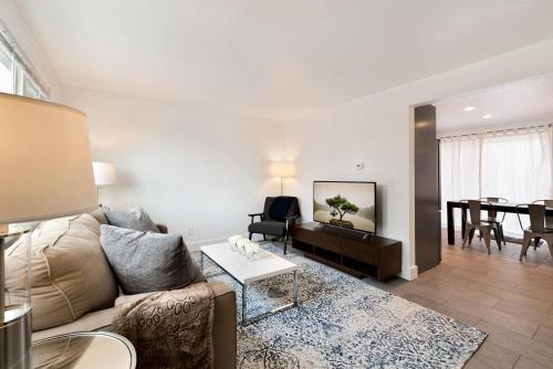 a living room with a couch and a table at Comfortable Abode Near Historic Downtown in Loveland