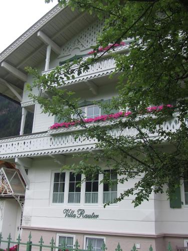 a white house with a sign on it at Villa Rauter Mayrhofen in Mayrhofen