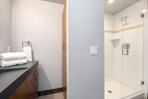 a bathroom with a shower and a sink at Relaxing in Paradise with Private Rooftop Deck! in Fort Collins