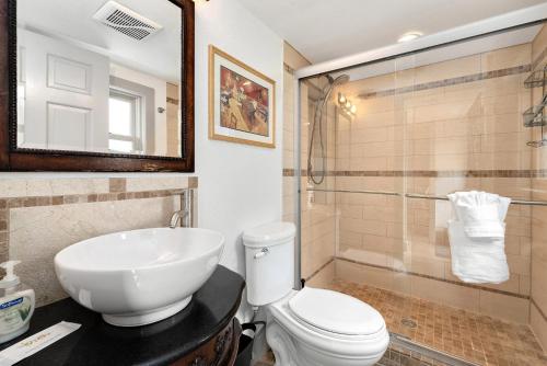 a bathroom with a sink and a toilet and a shower at Lola House! Cozy Comfort, Prime Old Town Location in Fort Collins