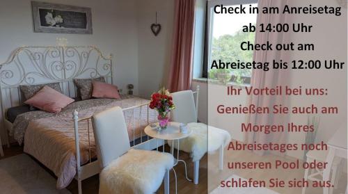 a poster of a bedroom with a bed and a table at Ursteirerhof - Familie Kerschbaumer in Palsdorf