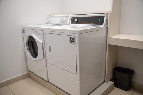 a white washer and dryer in a room at Holiday Inn Express & Suites - Ensenada Centro by IHG in Ensenada