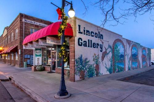 a street light in front of a building with a mural at Llama-Stay at Spooky Tooth Ranch - Mtn Views! in Loveland