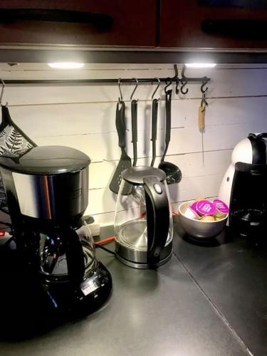 a coffee maker sitting on a counter in a kitchen at 15 min från Ullared! Ny stuga med hög standard! in Älvsered