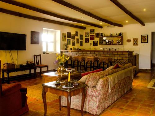 a living room with a couch and a table at Tambo Sapalanchan in Lamud