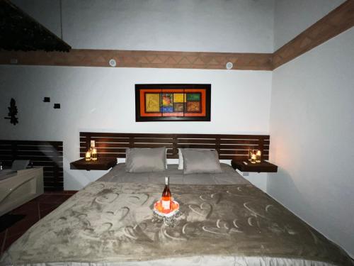 Ένα ή περισσότερα κρεβάτια σε δωμάτιο στο Hotel, Bungalows, Chalet y Cabañas Aventura Park Villa De Leyva La Periquera