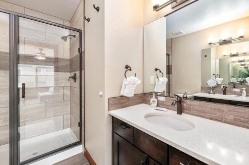 a bathroom with a sink and a shower at Spectacular Home near Breweries & River District! in Fort Collins