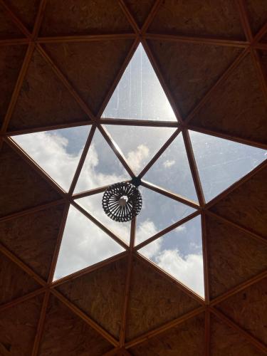 a view from the inside of a glass ceiling at Glamping y Chalet Aventura Park Villa De Leyva La Periquera in Villa de Leyva