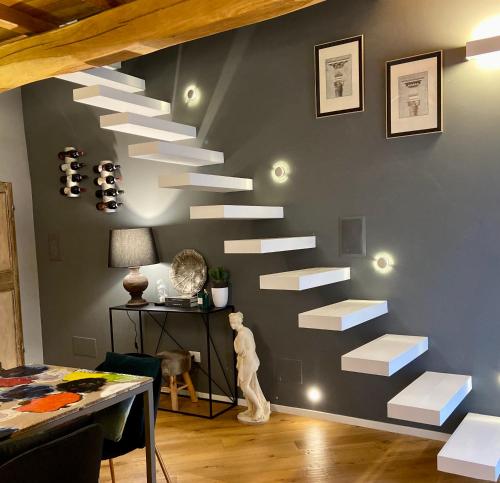 a wall with white stairs in a room at CivicoNove in Montefalco