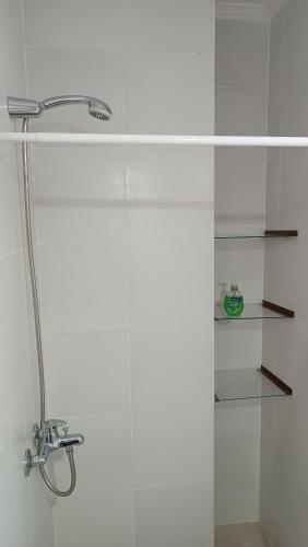 a bathroom with a shower with a glass door at Caá Guazú in Curuzú Cuatiá
