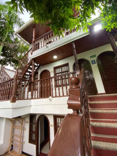 a house with a staircase in front of it at Hotel Casa Colonial in Barranquilla