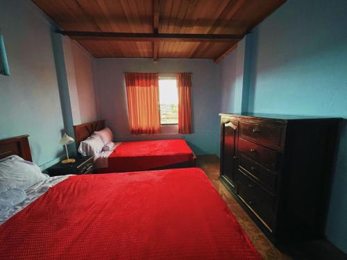 En eller flere senge i et værelse på Casa hospedaje Puyo