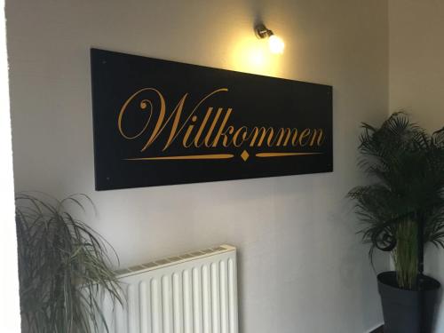a sign on a wall that reads williamuments at Altstadt Pension Herborn in Herborn