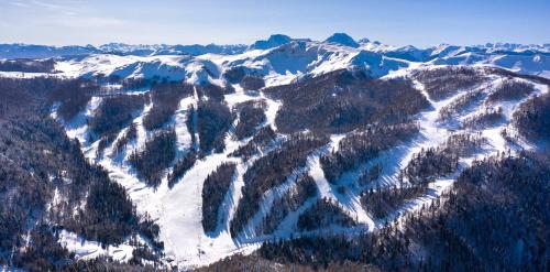 an aerial view of a snow covered mountain at Modern Harmony in Kolašin