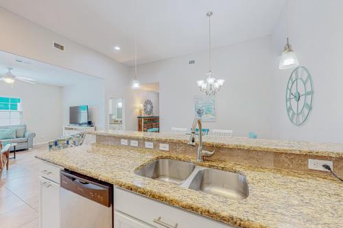 a kitchen with a sink and a counter top at Morgan Shores in Port Aransas