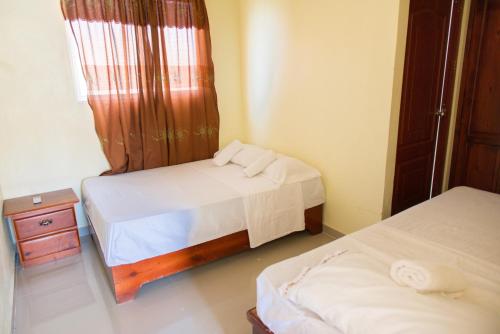 Postel nebo postele na pokoji v ubytování Double Room Near Airport in Santo Domingo Este