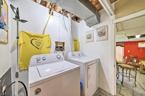 a kitchen with a washing machine and a sink at Hidden Paradise on 5 Acres with Hot Tub and Deck! 