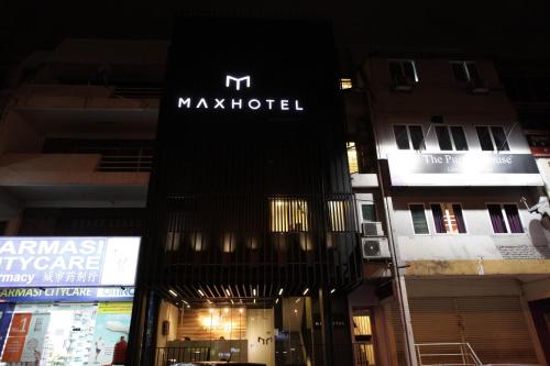 a building with a m mark hotel sign on it at MAX Hotel Subang Jaya in Subang Jaya