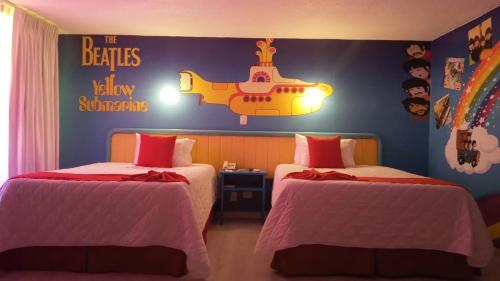 Ein Bett oder Betten in einem Zimmer der Unterkunft Hotel Medrano Temáticas and Business Rooms Aguascalientes
