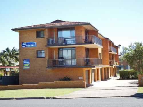 a large brick building with a sign on it at Seacrest 6 - Bring your own linen. in South West Rocks