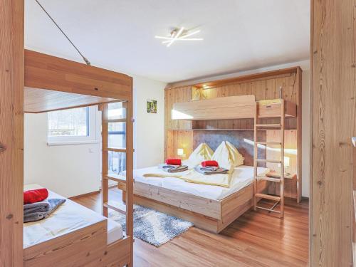 a bedroom with two bunk beds in a room at Krammer Großvenediger in Neukirchen am Großvenediger