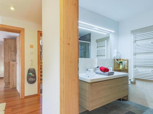 a bathroom with a sink and a mirror at Krammer XL in Neukirchen am Großvenediger
