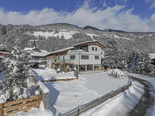 a large house in the snow with a yard at Krammer XL in Neukirchen am Großvenediger