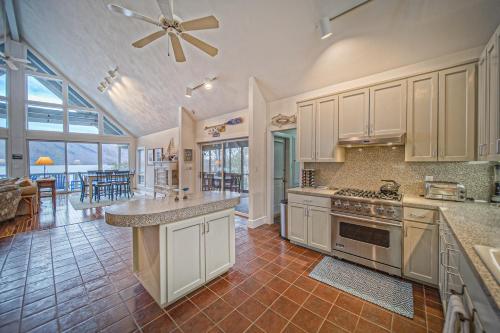 a kitchen with white cabinets and a stove top oven at Our Point of View in Huddleston