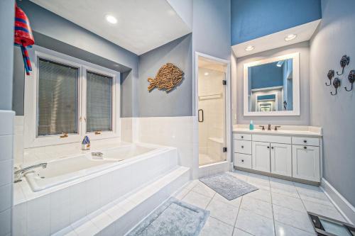 a bathroom with a tub and a sink at Our Point of View in Huddleston