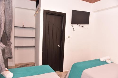 Ένα ή περισσότερα κρεβάτια σε δωμάτιο στο Hotel SAMAI