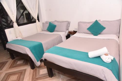 Ένα ή περισσότερα κρεβάτια σε δωμάτιο στο Hotel SAMAI